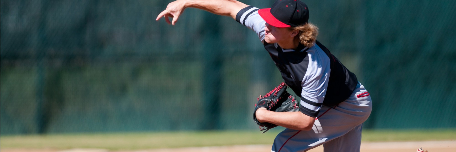 first base view of a pitcher delivering the bitch