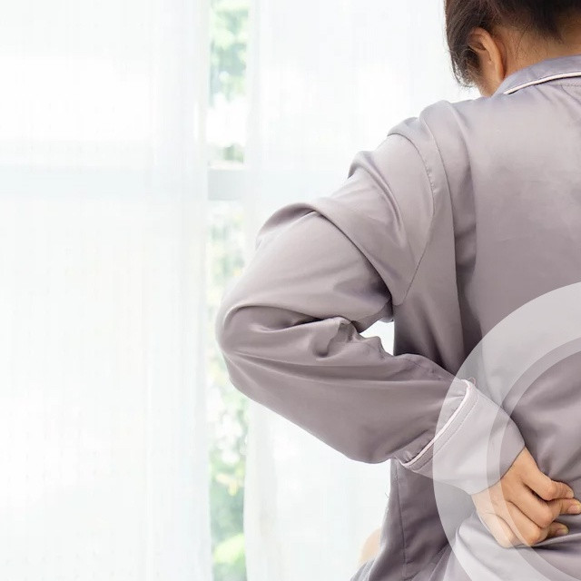 4 Tips to Help Prevent Back Pain in Bed, According to a Surgeon